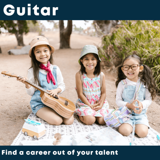 Little girls playing guitar in a music summer camp