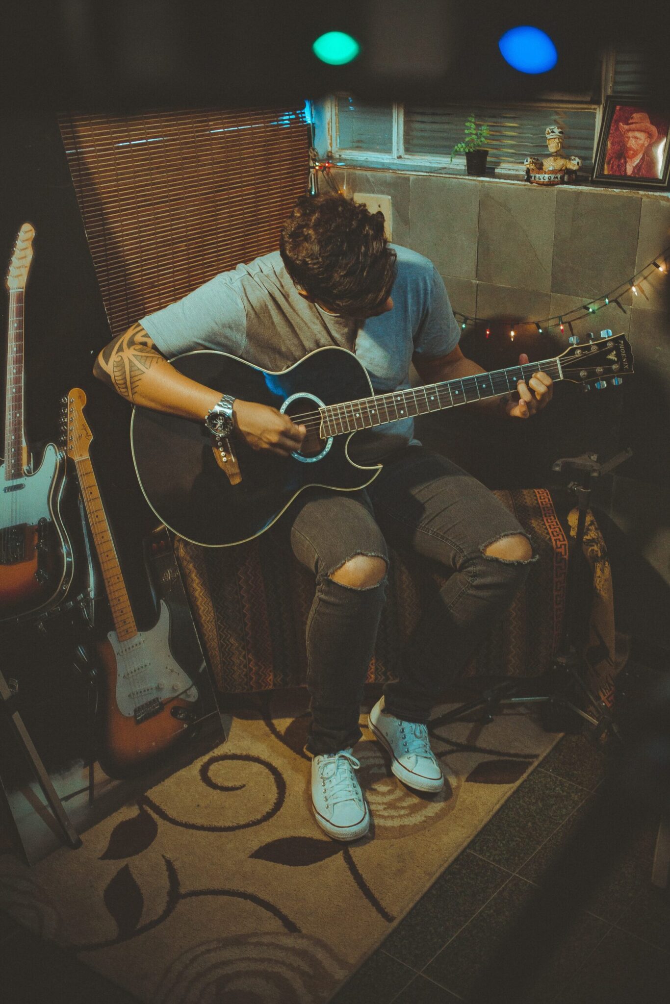 boy practicing electric guitar to get better with his music skills