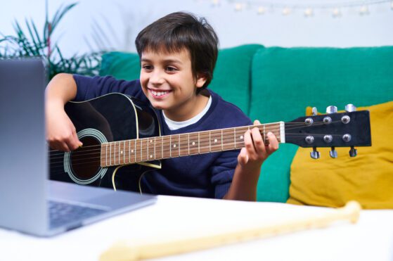 child learning guitar online - an image for the mystic keys blog