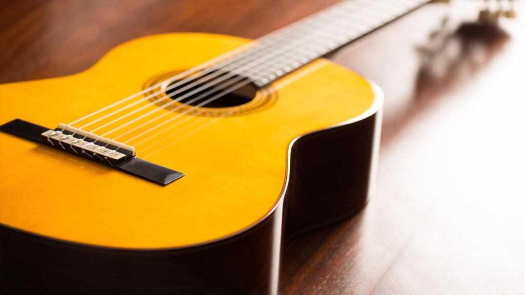 Guitar, representing the foundational chords essential for beginners to learn