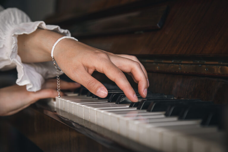 image of hands shown playing piano