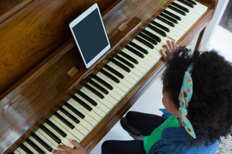 child playing piano using an app