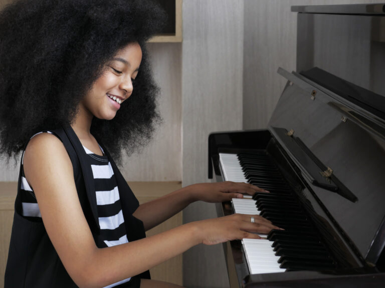 girl playing a popular song on piano