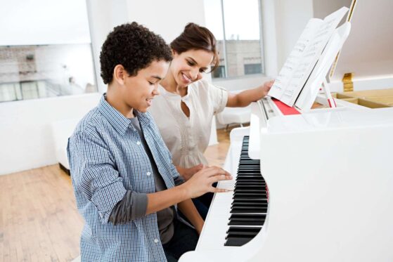 Improving Piano Playing by Ear for Intermediate Students- boy learning piano