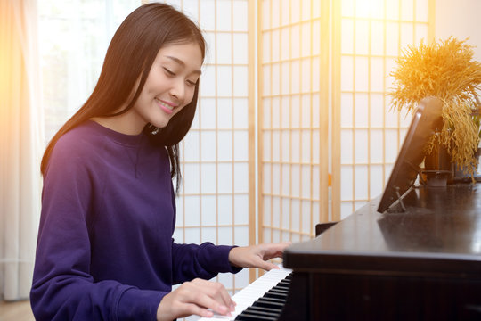 Affordable Piano Practice Space Ideas - Girl playing Piano