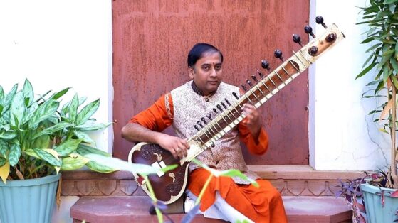 practice music- playing sitar