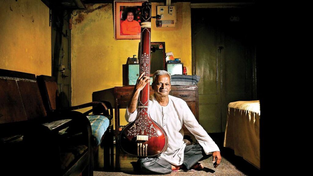 Man playing Tanpura