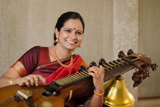 Carnatic music terms- woman playing veena