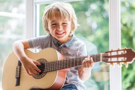 Finger Picking Techniques - boy playing guitar