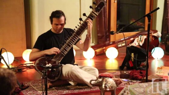 regular riwaaz, man playing sitar