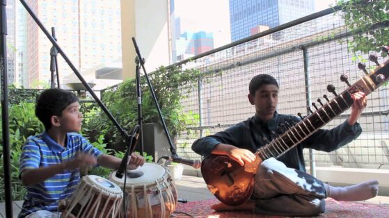 boys playing tabla and sitar