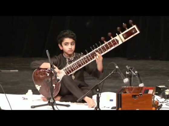 boy playing sitar