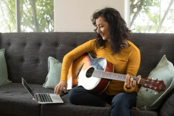 Finger Picking Techniques - girl playing guitar