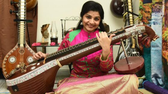 Carnatic music terms- woman playing veena