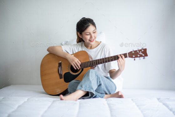 Finger Picking Techniques - girl playing guitar