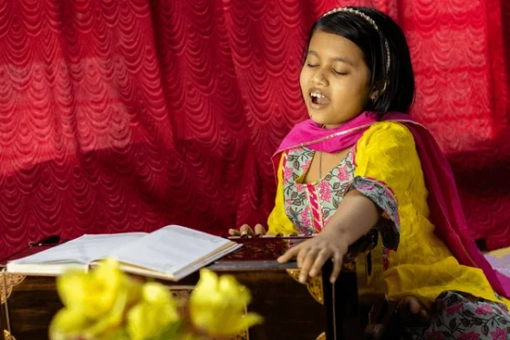 Hindustani music for children- girl playing harmonium