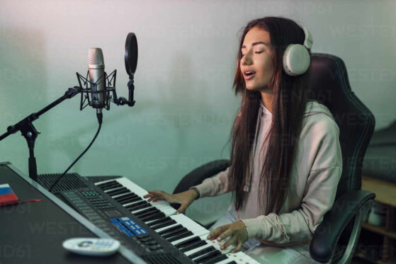 Girl playing piano & singing