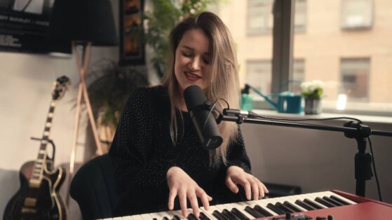 Girl playing piano & singing