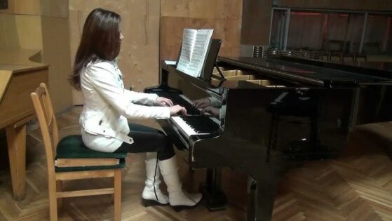 Girl playing piano with sustain pedal