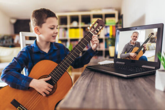 Boy learning Electric Guitar Online