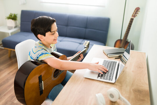 Boy learning Electric Guitar Online