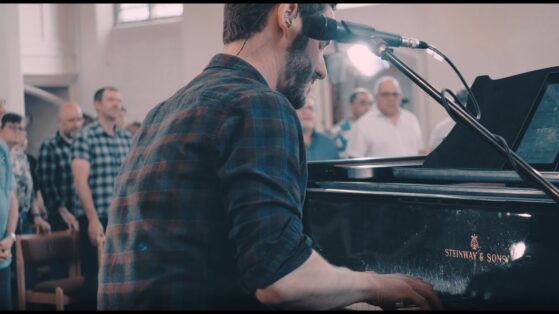 man playing piano | worship services