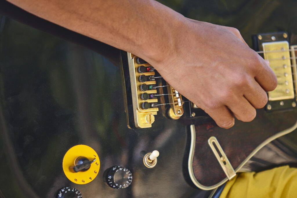 Man learning electric guitar chords, playing electric guitar detail. Musician. Musical instrument.