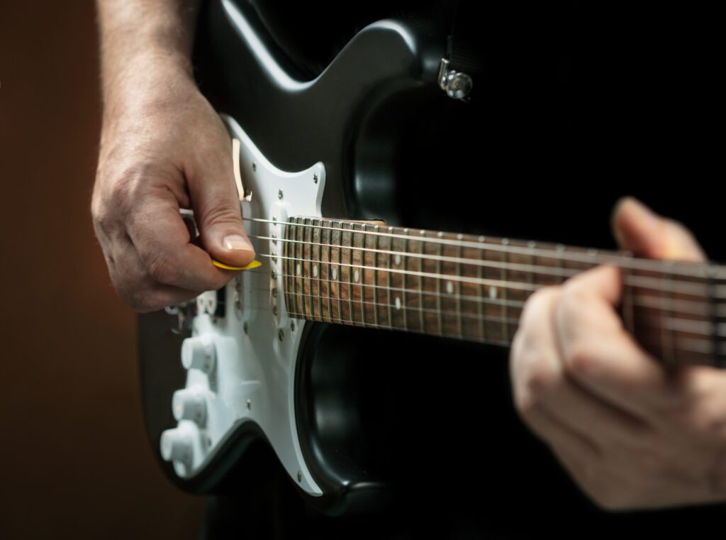 Man trying to Master electric guitar