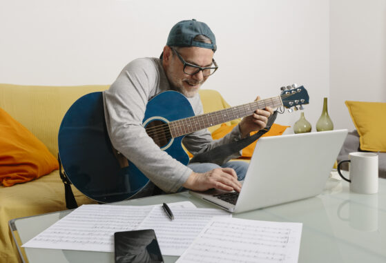 teacher teaching guitar