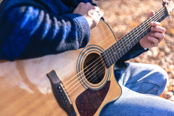 Learn Acoustic Guitar or Electric Guitar | Man playing acoutic Guitar