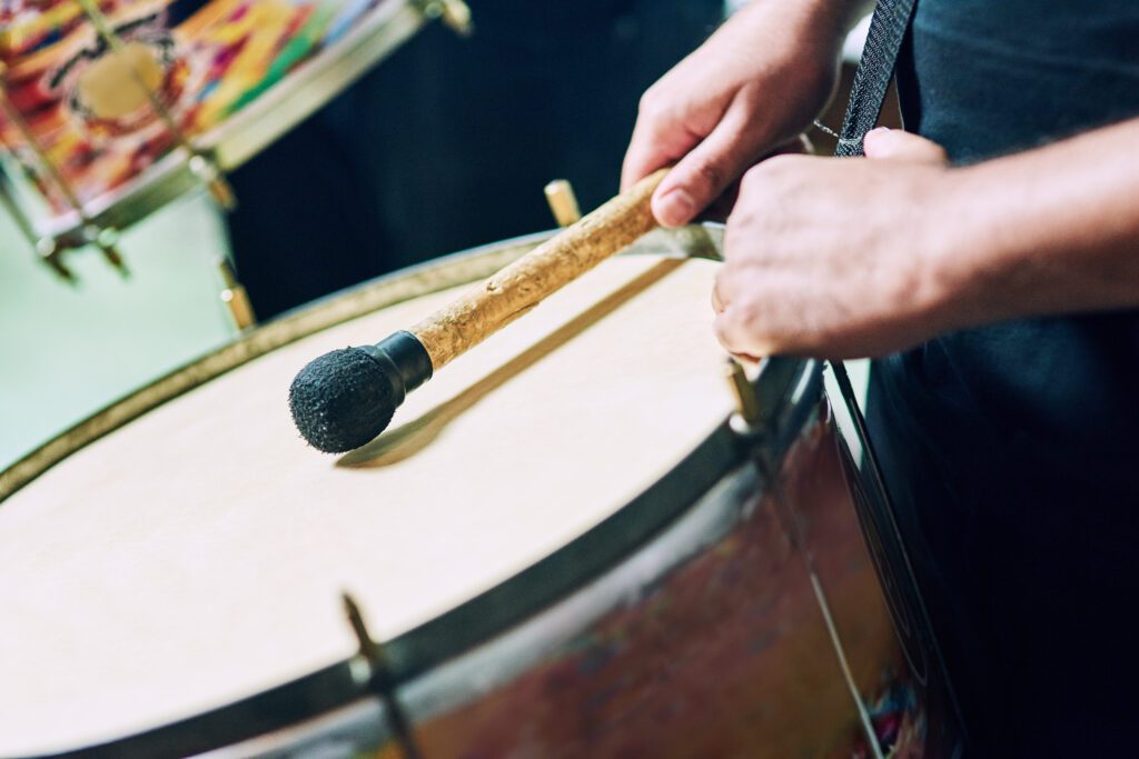 Basic Drumming Techniques Now that your kit is ready, let’s cover essential techniques for beginners: Proper Grip and Stick Control: Grip: Hold the stick between your thumb and index finger, resting it on your middle finger for a firm yet relaxed hold. Movement: Move sticks up and down from your wrists and fingers, not your arms, to avoid strain. Practice: Focus on single strokes, double strokes, and rudiments like paradiddles to enhance your control. Mastering these basic drumming techniques will set a solid foundation for your drumming journey!