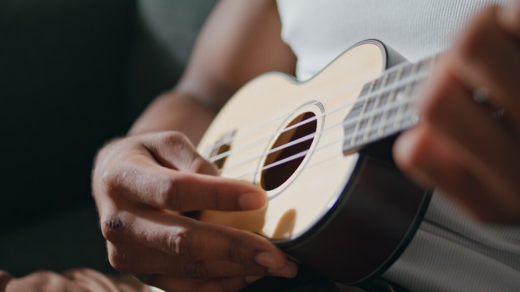 a man try learning ukulele