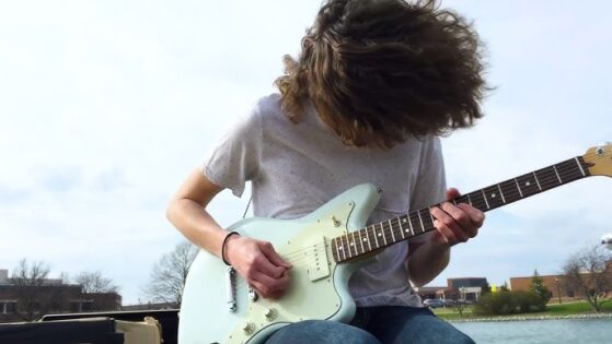 Boy playing guitar | electric guitar techniques