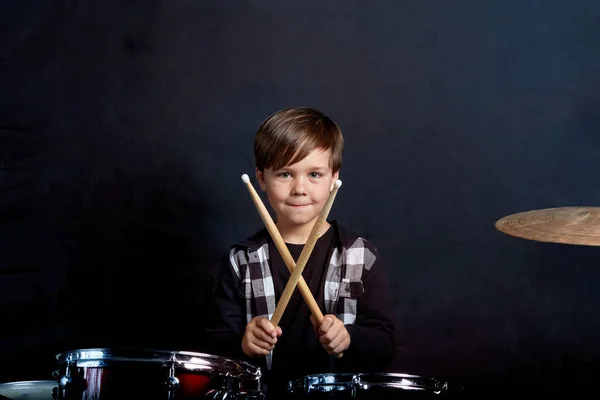 boy playing drums