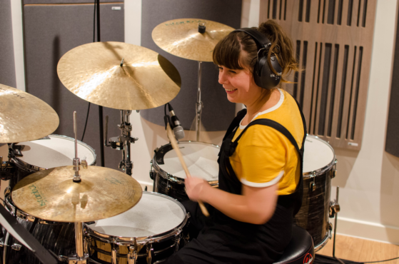 Girl playing drums