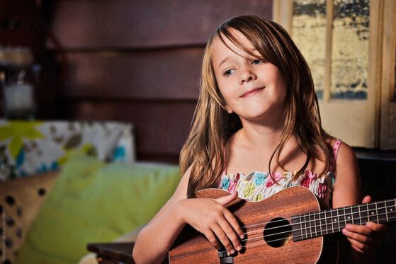 Girl playing ukulele