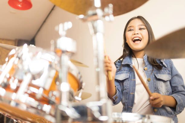 girl playing drums