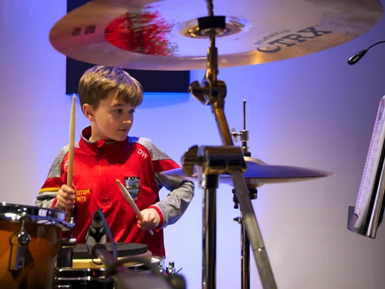 boy playing drums