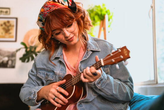 girl playing ukulele