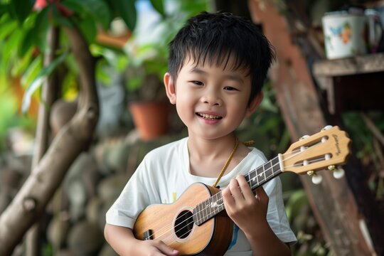 Boy playing ukulele