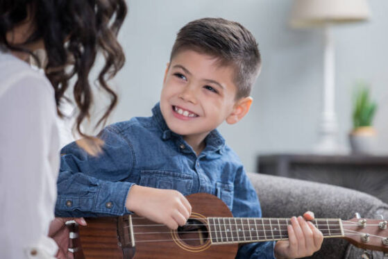 Boy playing Ukulele