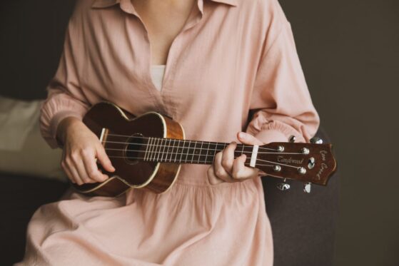 girl playing ukulele