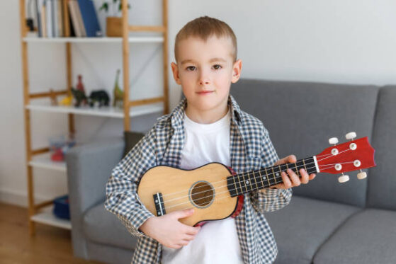 Boy playing Ukulele