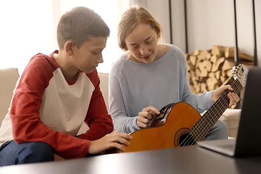 Parents and child playing piano