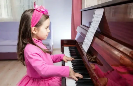 girl playing piano