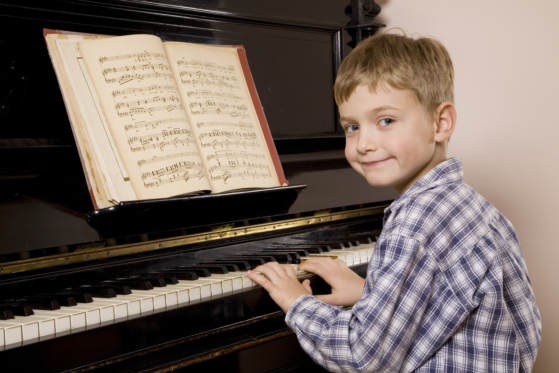 boy playing piano