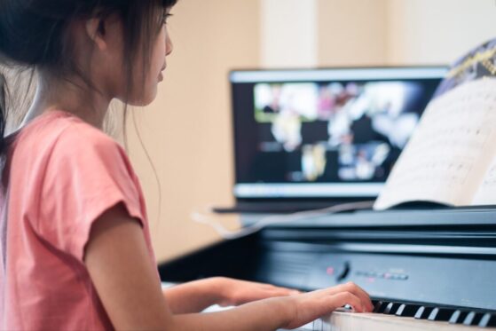 girl playing piano