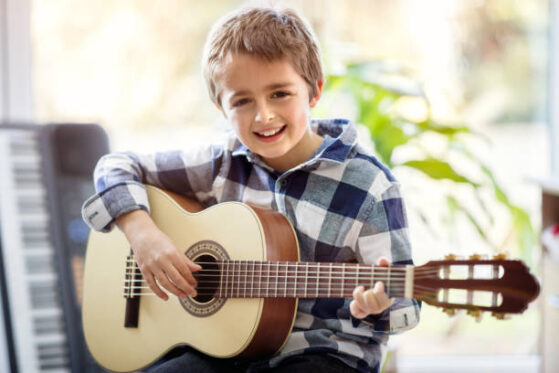 boy playing guitar