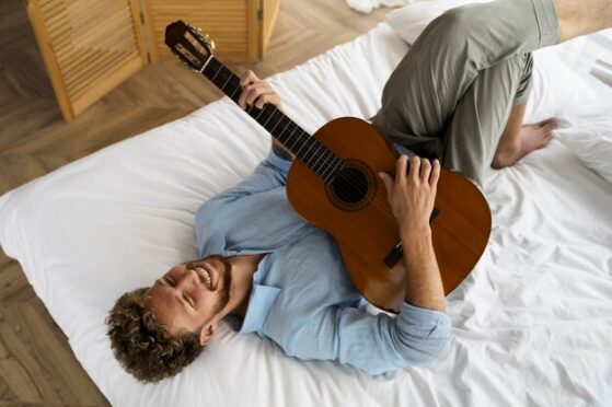 Rest boy playing guitar