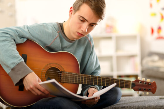 boy playing guitar